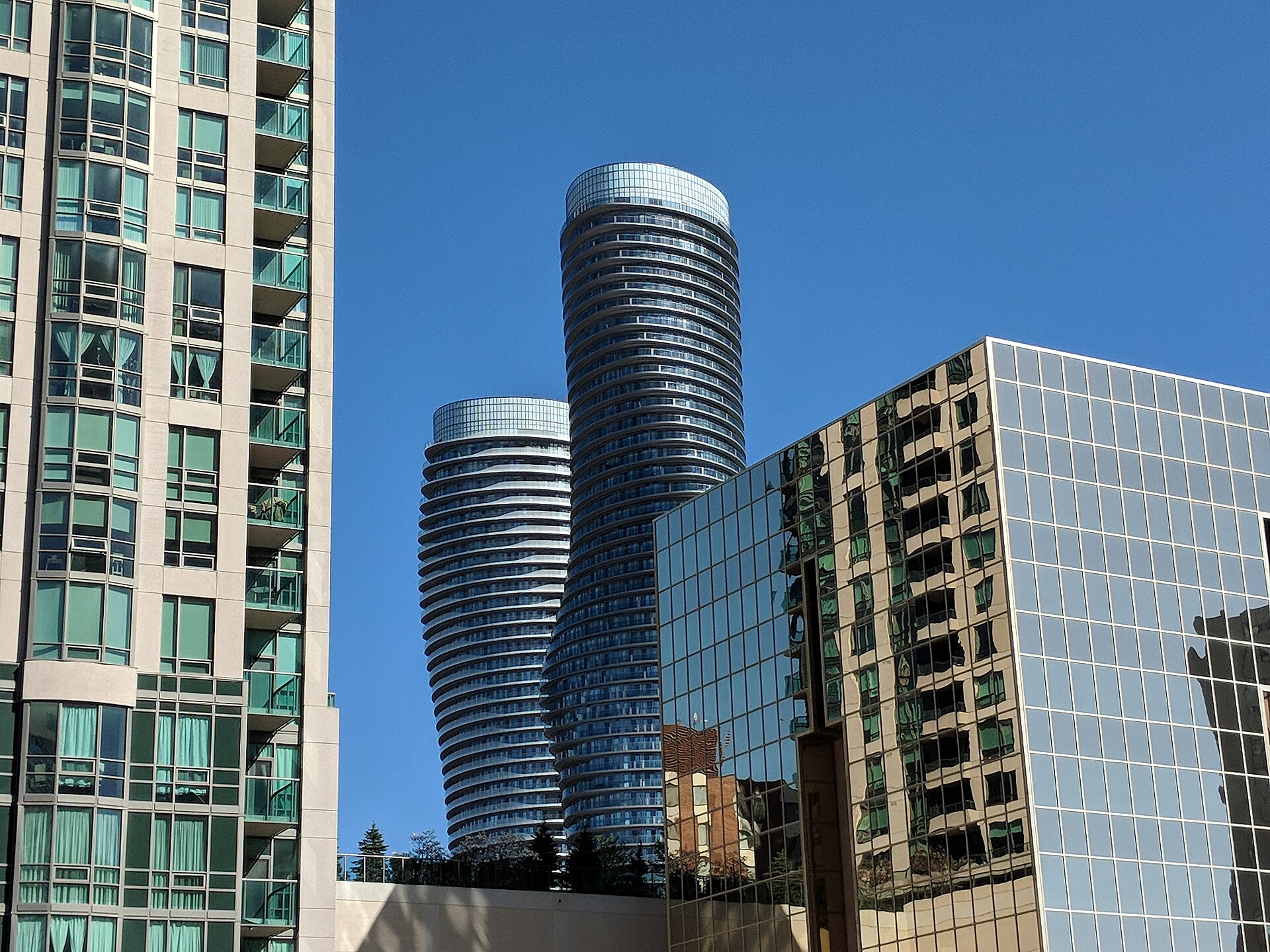 Mississauga Absolute World twisted towers against a blue sky