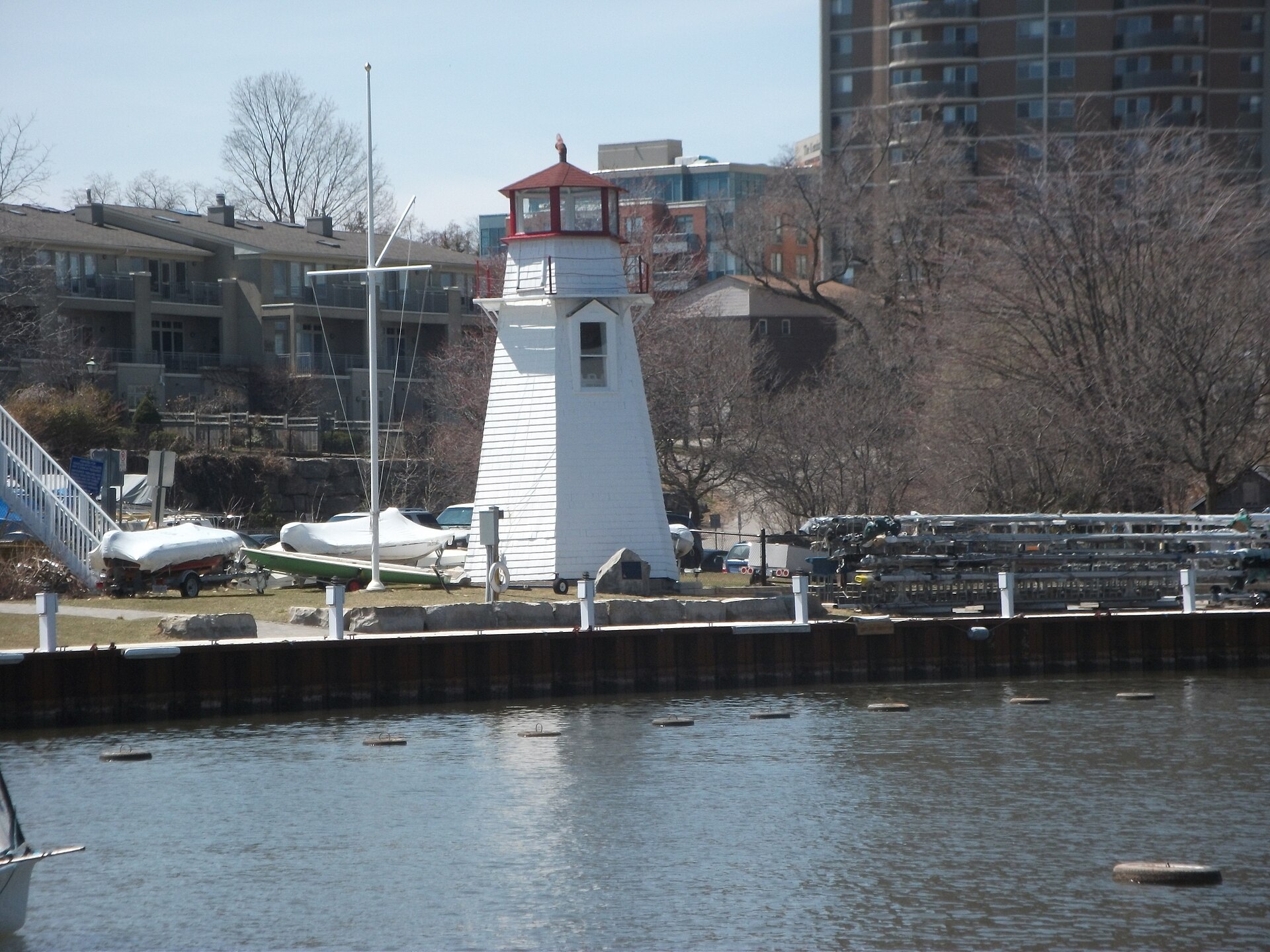 Oakville Harbour sailboats and lighthouse at sunset